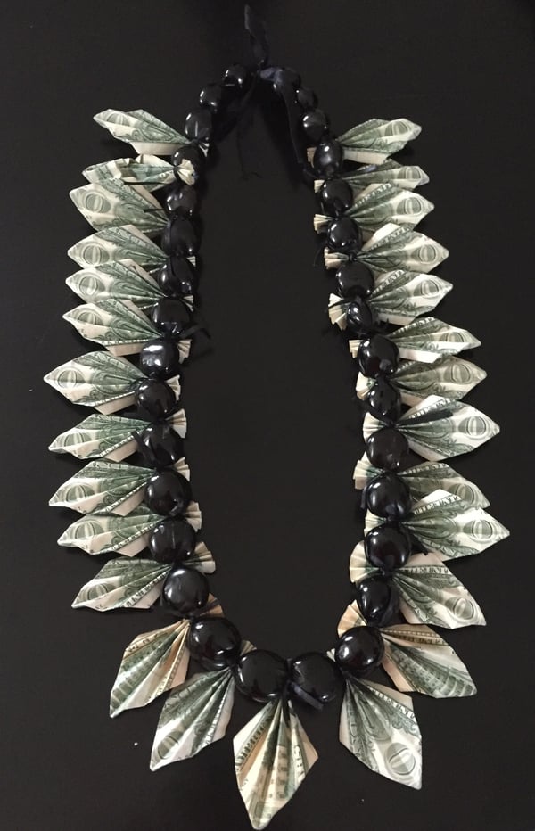 Image of black kukuinut money lei