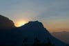Hazy sunrise behind Going-to-the-Sun Mountain - Glacier National Park