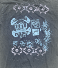 Image 2 of black tee with light blue and pink prints