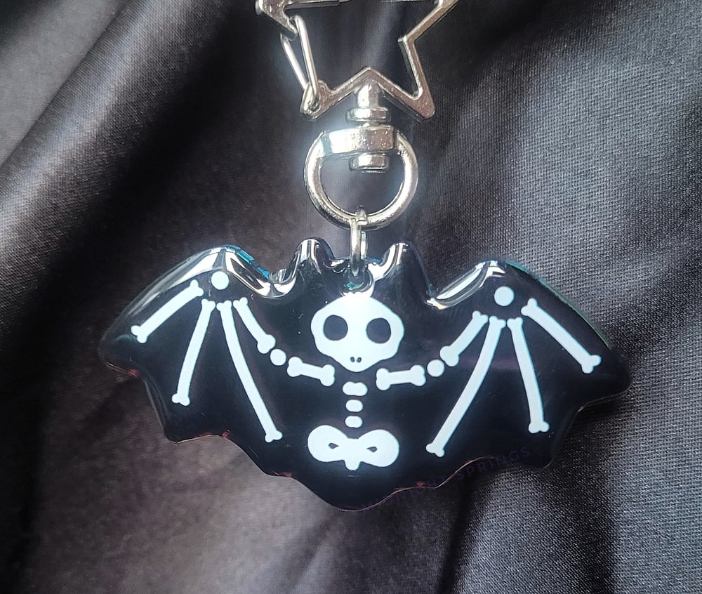 Image of Skelebat Acrylic Keychain with Holographic Background