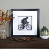 Framed Papercut Female Road Bike Scene