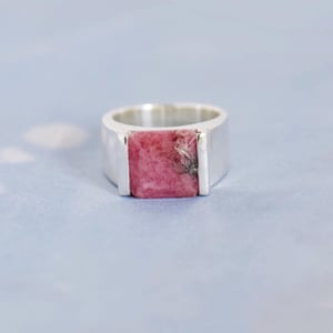 Image of Rhodochrosite square cut wide band solid framed silver ring