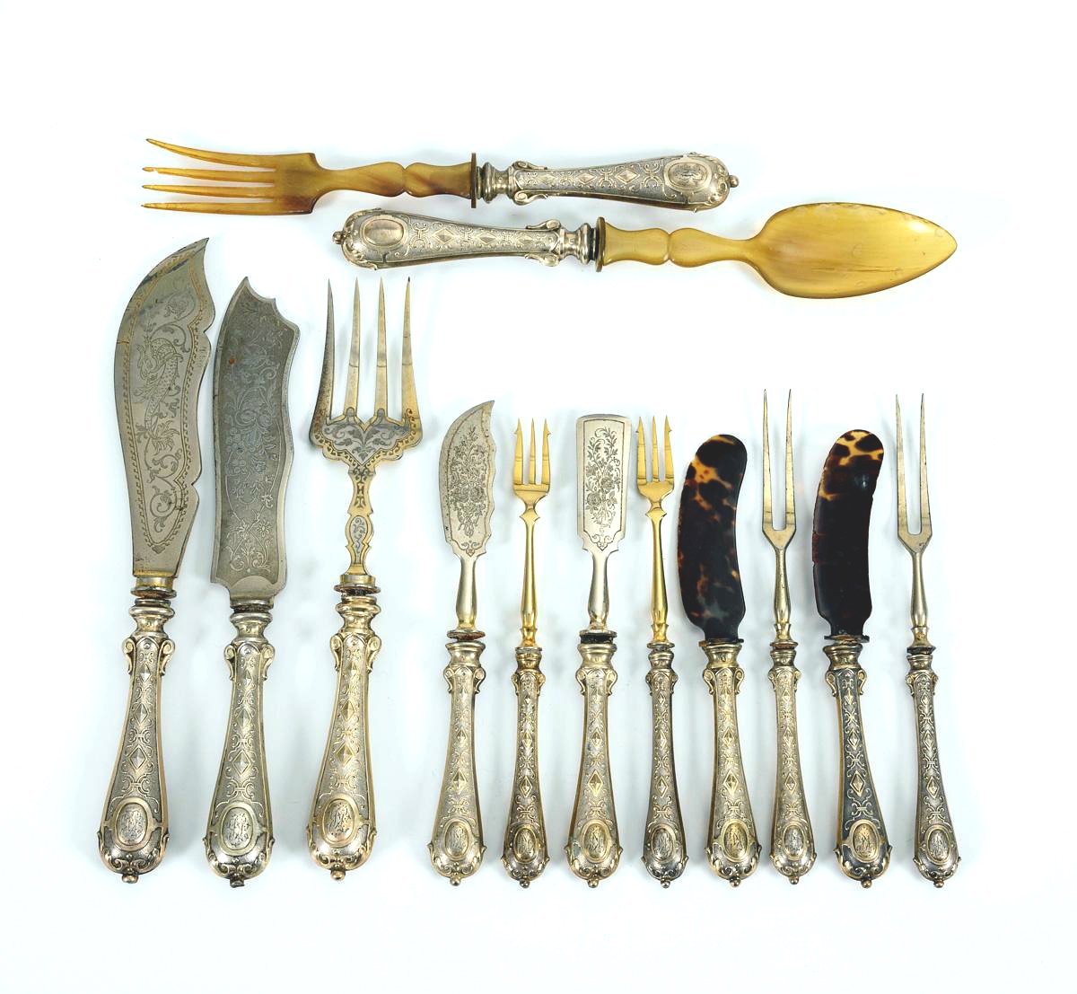 Image of A group of 13 exceptional French parcel-gilt 19th century silverware pieces