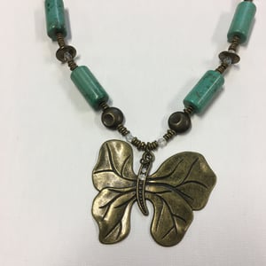 Image of "Emergence" - Butterfly, turquoise magnesite, African brass heishi.