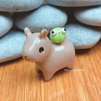 Image 2 of capybara with frog ceramic figurine