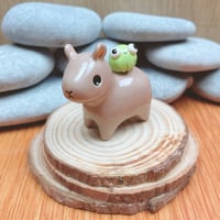 Image 3 of capybara with frog ceramic figurine