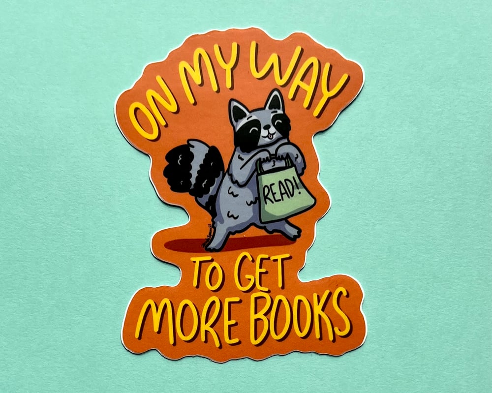 Image of Reading raccoon vinyl sticker