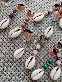 Image of Cowrie loc and braid jewelry 