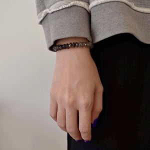 Image of Premium Black Rutilated Quartz (Toumarlined Quartz) faceted cut flat beans x silver spheres bracelet
