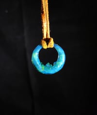 Image 1 of Simplistic crescent moon pendant. (Double sided face sculpt)