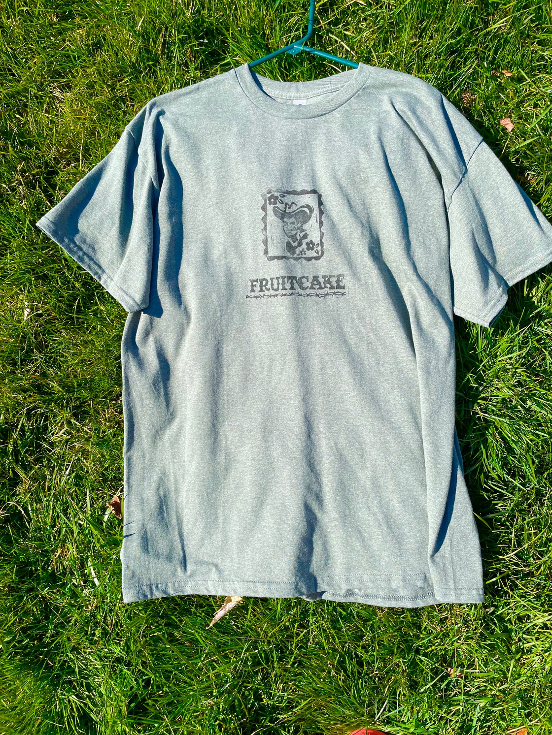 Image of Sage Fruitcake Cowboy Tee