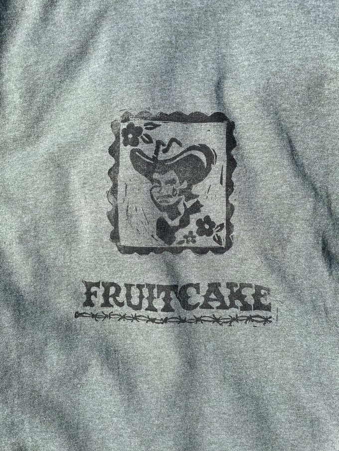 Image of Sage Fruitcake Cowboy Tee