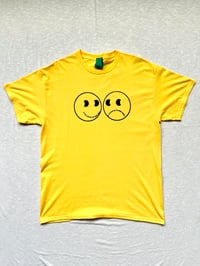 Image of the smile/frown tee in yellow 