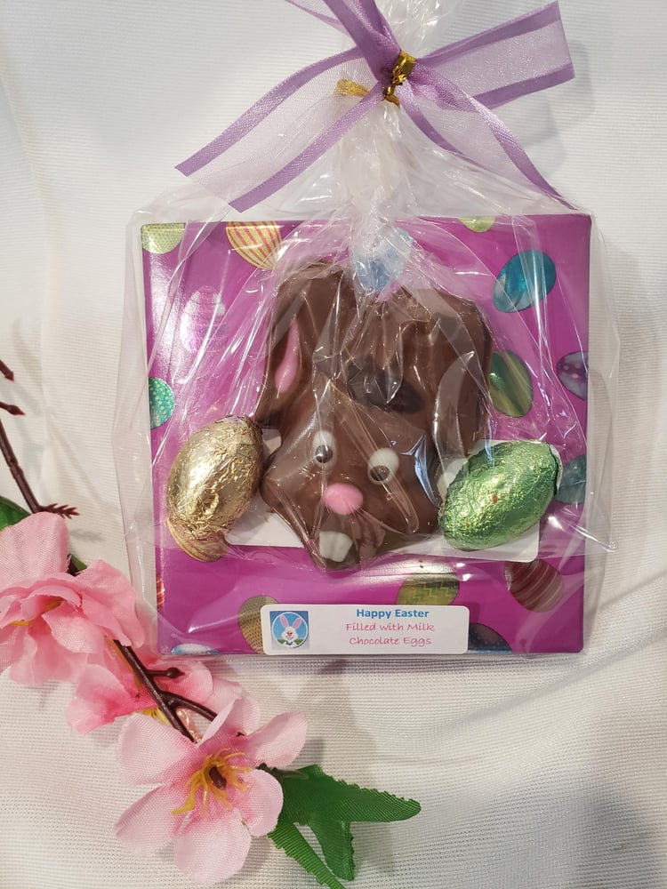 Image of Cheeky Easter bunny with purple egg box