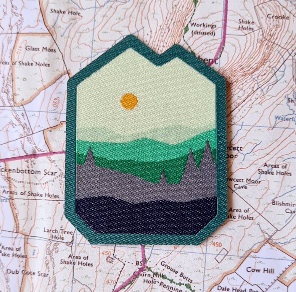 Image of Hill and Dale Woven Patch - a colourful landscape patch with iron-on backing