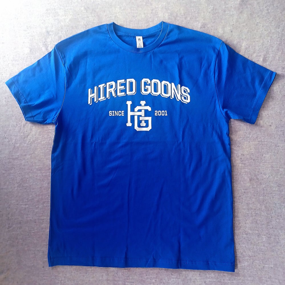 Image of "Hired Goons" College shirt.  White on Royal Blue