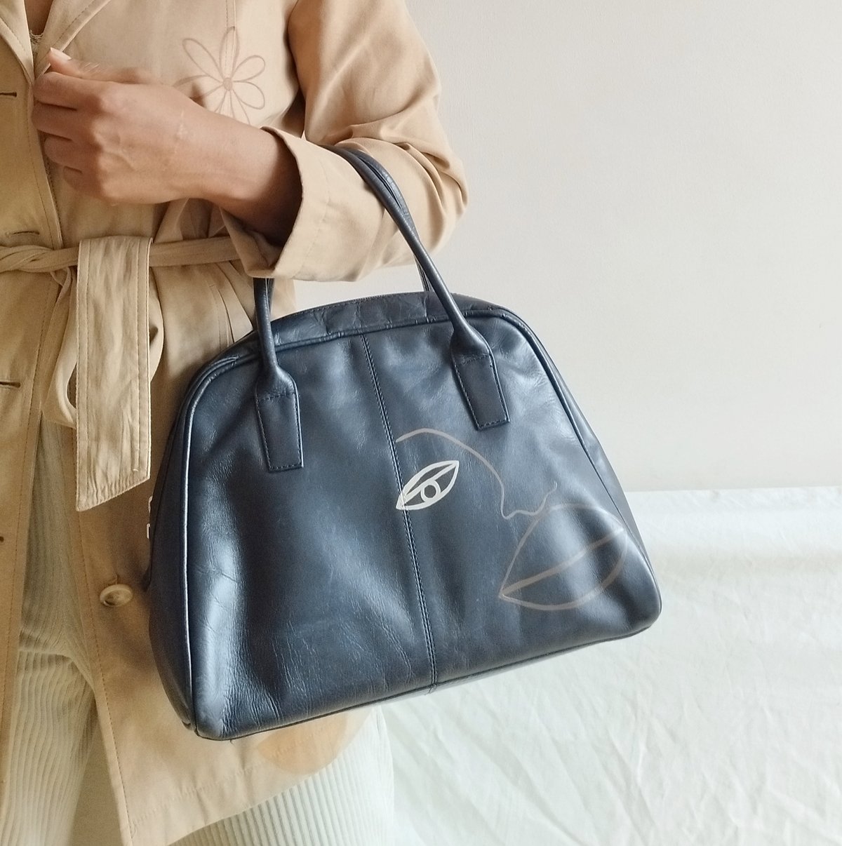 Image of navy bowler bag