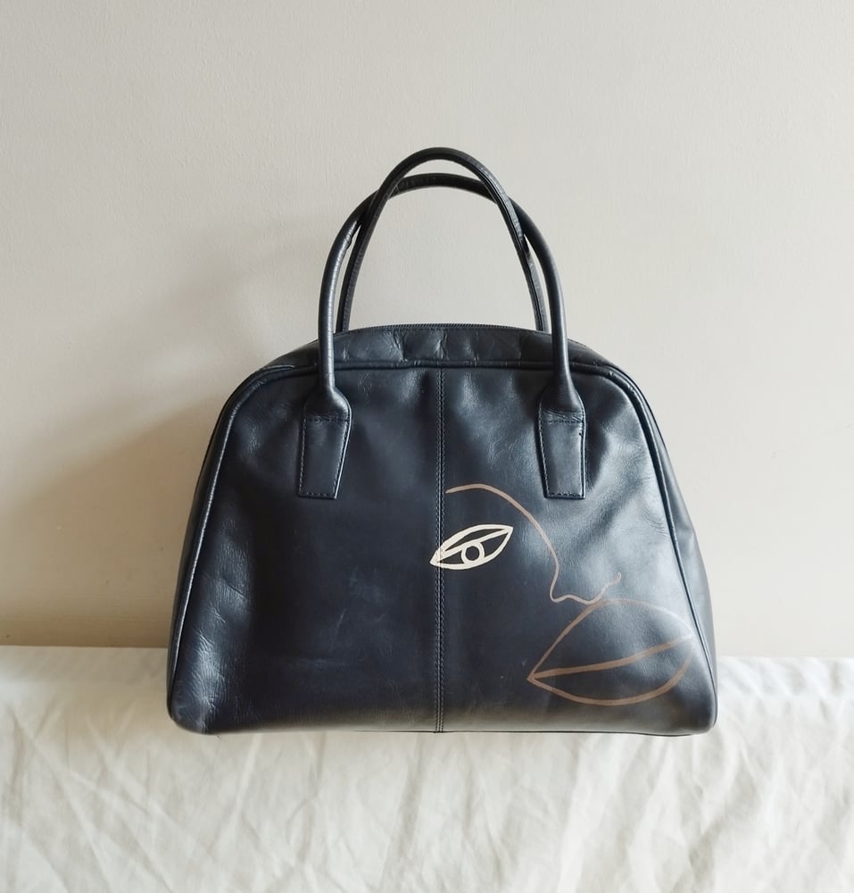 Image of navy bowler bag