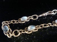 Image 1 of Edwardian 9ct rose gold lovers knot moonstone bracelet 14.1g 