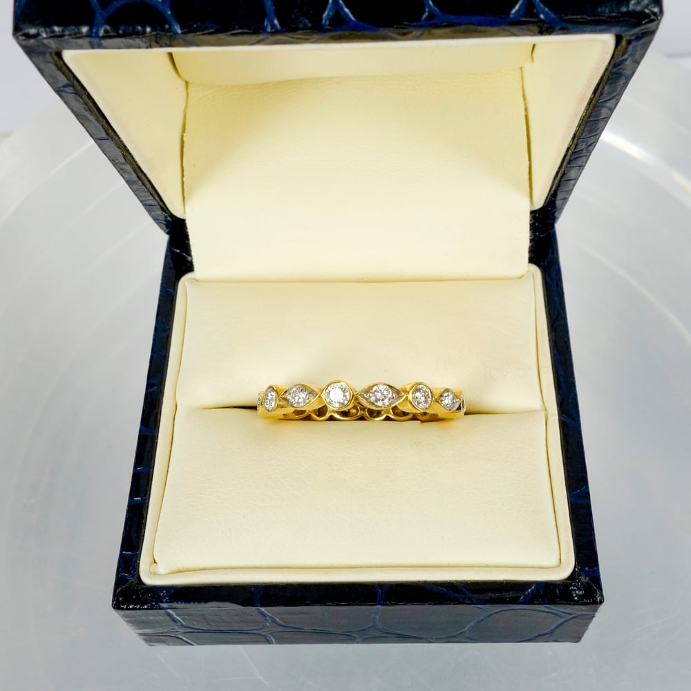 Image of 18ct yellow gold diamond set celebration ring. PJ4411