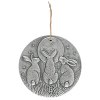 Moon grazing hares plaque