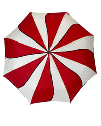 Red and white swirl umbrella