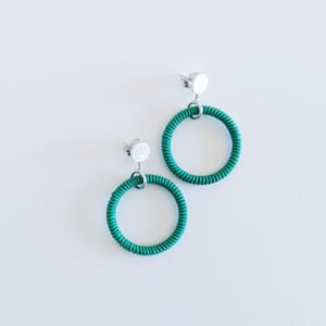 Image of Green round dangle earrings