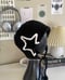 Image of black chunky star earflap hat