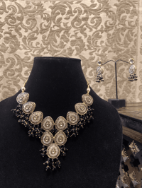 Image 1 of Midnight's Grace: The Black and White-gold Kundan Party Wear Set