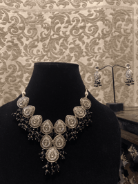 Image 2 of Midnight's Grace: The Black and White-gold Kundan Party Wear Set