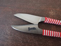 Image 2 of Japanese Thread Snips with red tassel.