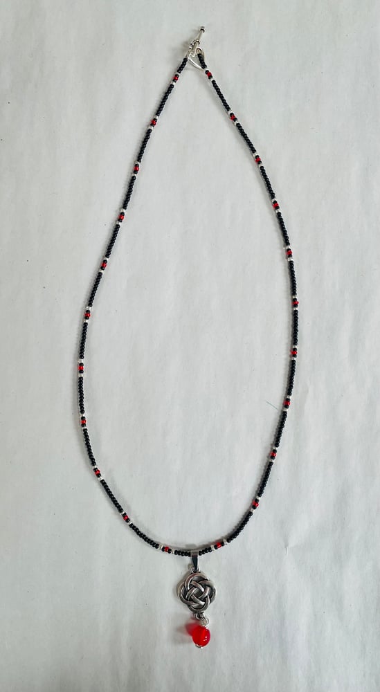 Image of Celtic knot necklace with red agate