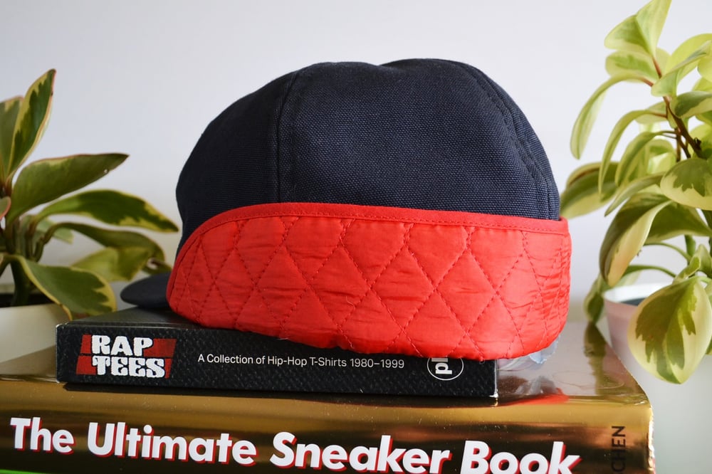 Image of Supreme X Red Built Navy Canvas Flip Down Quilted Workwear Hat Sz.L/XL