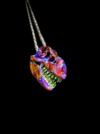 Amber purole trex skull pendant with illuminati teeth 