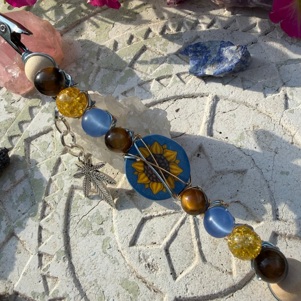 Image of sunflower kush roach clip