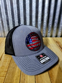Image 1 of Flag Heather/Black Trucker Hat