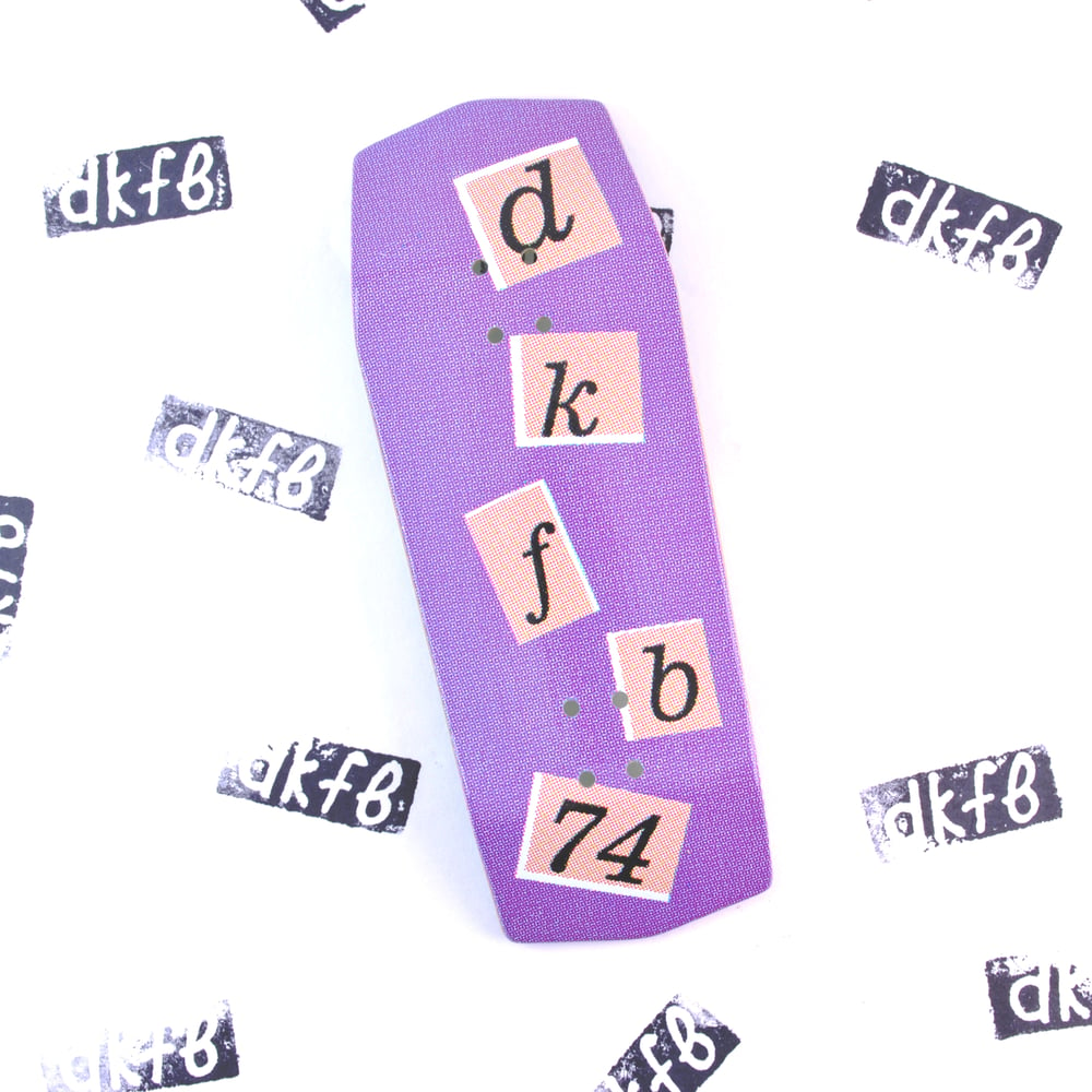 Image of letters purple real wear