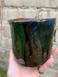 Image 4 of a silent frog plant pot