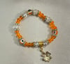 Orange lucky charm bracelet 