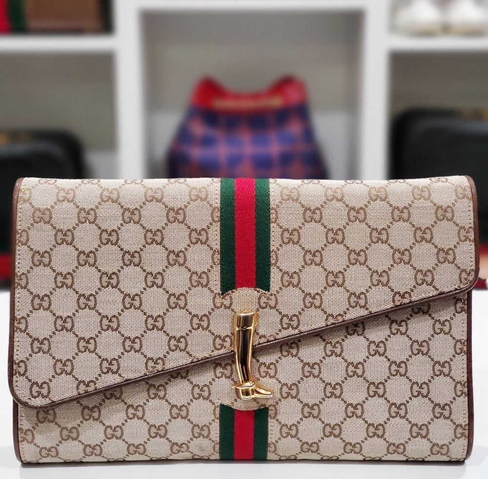 Image of Vtg. Gucci Brown Monogram Equestrian Clutch.