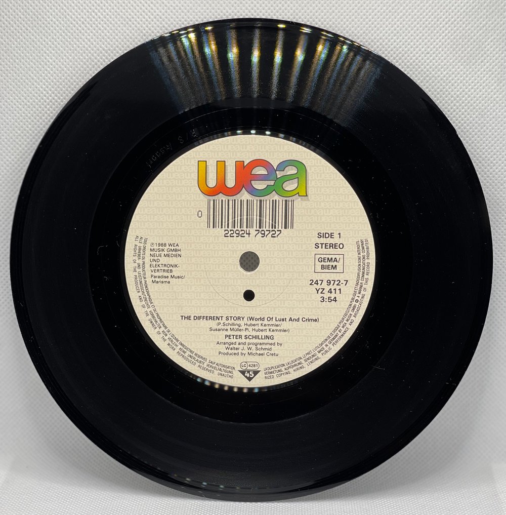 Schilling* – The Different Story (World Of Lust And Crime) 1988 7” 45rpm