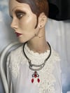 Asymmetrical Upcycled Necklace with Black And Red Gothic Charm.