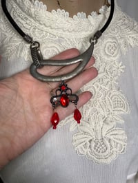 Image 4 of Asymmetrical Upcycled Necklace with Black And Red Gothic Charm.