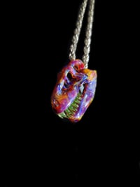 Image 3 of Mini amber purple T-REX skull pendant with illuminati teeth.