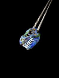 Image 1 of Mini mystery adventurine T-REX skull pendant. 