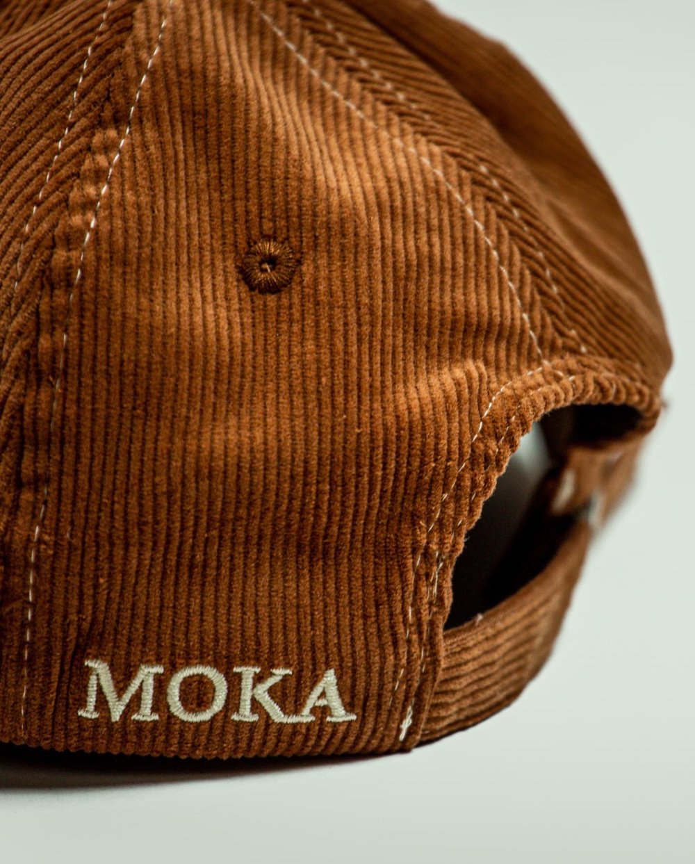 M cap brown