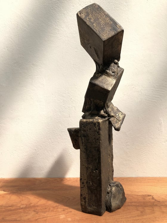 Image of brutalist sculpture (dark gold)