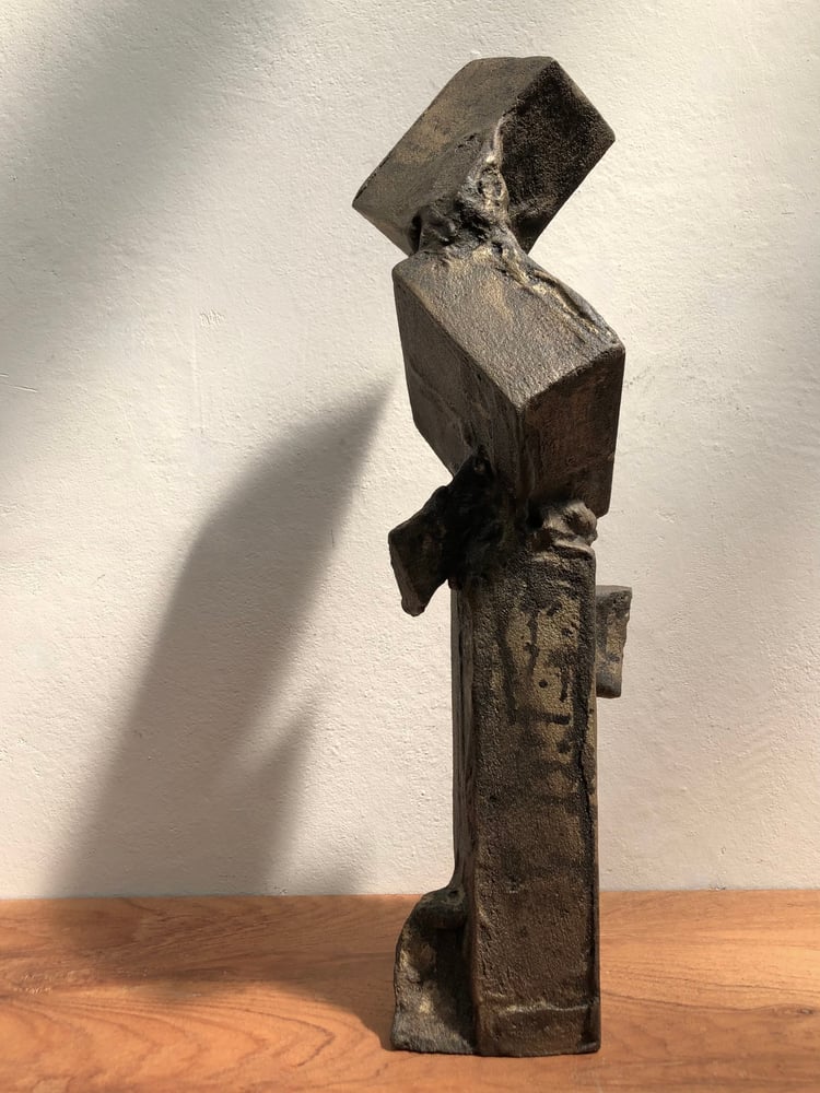 Image of brutalist sculpture (dark gold)