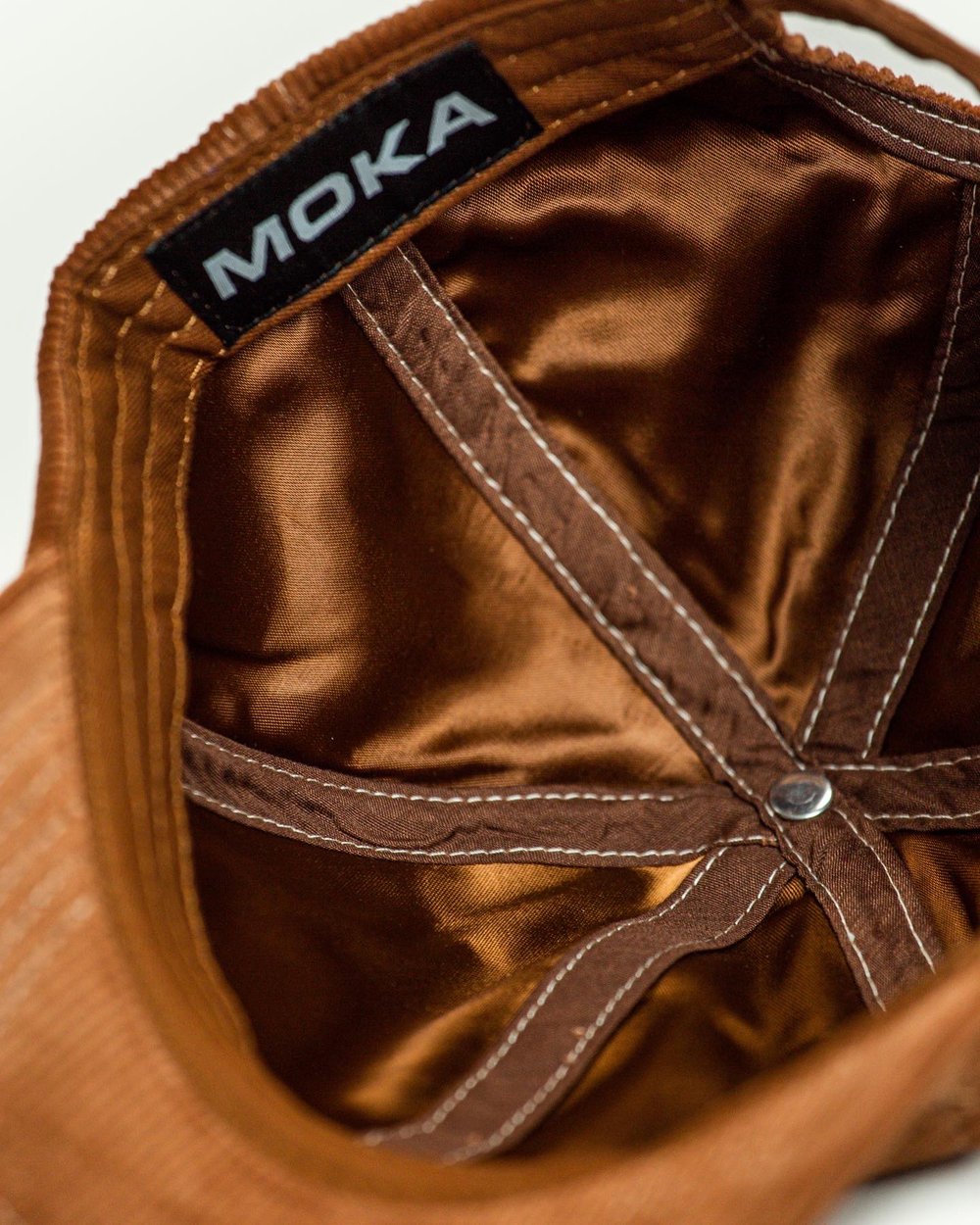 M cap brown