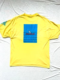 Image of shark in the water tee in yellow 